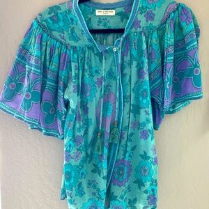 This is a Spell button up top. No stains. Size S